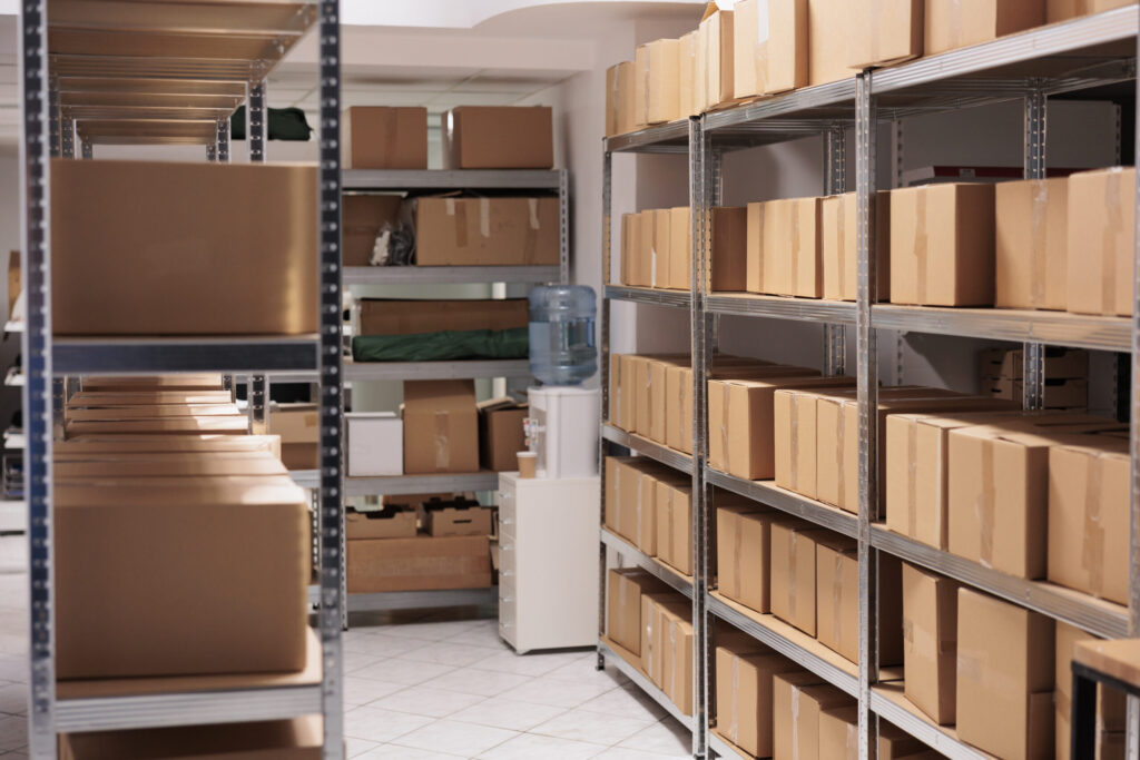 storehouse interior with stacked cardboard boxes on racks